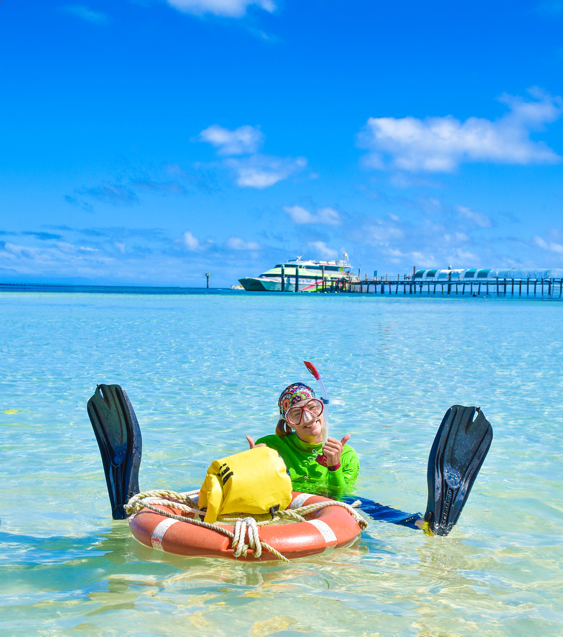 Girl Snorkelling at Green Island with Big Cat.